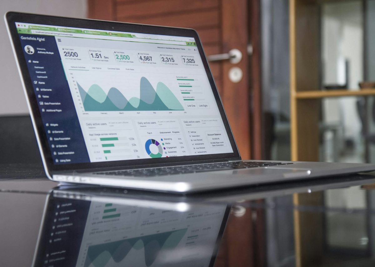 Laptop showing an accounting dashboard with financial charts