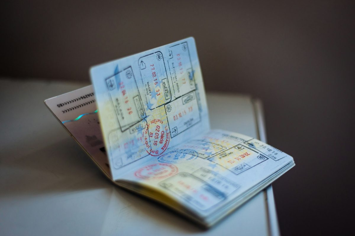 Open passport with visa and entry stamps